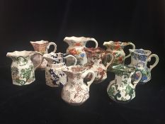 A selection of Nine Masons jugs