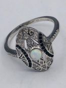 A Silver Cz and Sapphire ring Art Deco Style with central Opal panel.