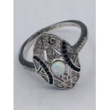 A Silver Cz and Sapphire ring Art Deco Style with central Opal panel.