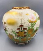 A Japanese vase, cream grounds and floral design, boxed.