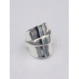 A solid silver spoon ring made from Antique cutlery by an Artisan. Successful bidders can notify