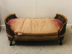 A Burr Walnut caned Bergere Day Bed with carved scrolled hoof feet. 159cm L x 74cm D