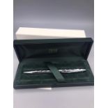 A cased Concorde Cross pen