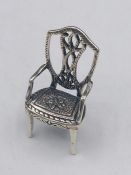 A Sterling Silver figure of a chair