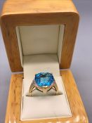 A Swiss Blue Topaz and Diamond Ring 4.8carat Heart shaped cut Topaz with two accent diamonds set