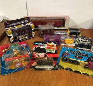 A selection of boxed toy cars and Pokémon to include Batman and Hotwheels.