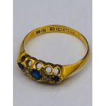 An 18ct gold ring with sapphires and diamonds