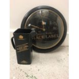 A Johnnie Walker Black Label Wall Clock Along With A Johnnie Walker Jug.