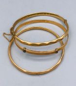 Three 9ct gold plated bracelets