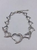 A silver bracelet with Heart shaped links