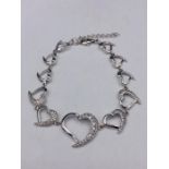 A silver bracelet with Heart shaped links