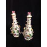 A Pair of Meissen lidded vases with floral decoration.
