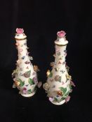 A Pair of Meissen lidded vases with floral decoration.