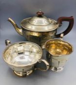 A Silver tea service to include teapot, sugar bowl and milk jug, hallmarked Birmingham 1949-50 (