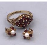 A pair of earrings and ring on 9ct gold.