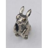A silver rabbit figure