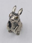 A silver rabbit figure