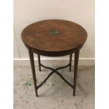 An Edwardian round Mahogany occasional table decorated with hand painted center.