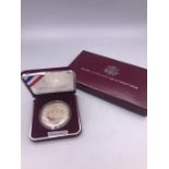 A Cased Silver proof 1988 Olympic coin (USA)