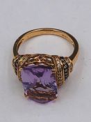 A 14ct Rose Gold substantial amethyst and diamond ring