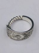 A solid silver spoon ring made from Antique cutlery by an Artisan. Successful bidders can notify