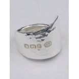 A solid silver spoon ring made from Antique cutlery by an Artisan. Successful bidders can notify