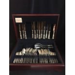 A six hallmarked setting silver cutlery service in a mahogany box, unused. By United Cutlers
