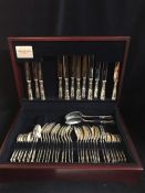 A six hallmarked setting silver cutlery service in a mahogany box, unused. By United Cutlers