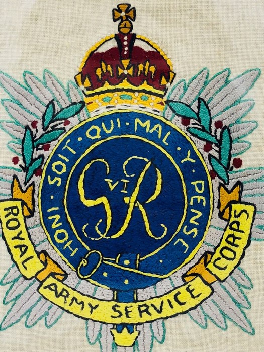A Royal Army Service corps silk embroidered emblem, framed.
