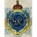 A Royal Army Service corps silk embroidered emblem, framed.