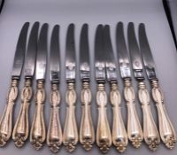 A selection of eleven Swedish hallmarked silver knives