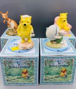 A selection of four Royal Doulton Winnie The Pooh china figures boxed.