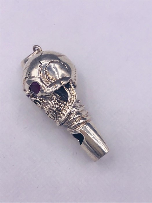 An unusual silver skull shaped whistle with ruby eyes - Image 2 of 3