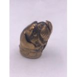 A brass dogs head vesta case