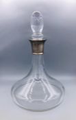 A silver necked ships decanter, hallmarked.