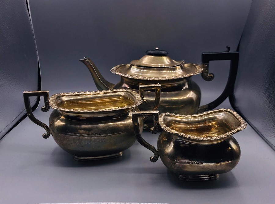 A Hallmarked silver tea set, with tea pot, milk jug and sugar bowl. AF