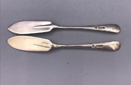 Two silver butter knives, hallmarked.