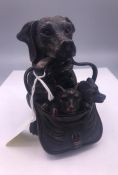 A well carved black forest inkwell in the form of a dog and her puppies