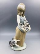 Lladro figure of a girl carrying kittens with a cat