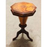 A sewing table on tripod pedestal legs with an inlay central pattern of a bird and flowers AF