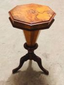 A sewing table on tripod pedestal legs with an inlay central pattern of a bird and flowers AF