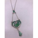 A silver and enamel pendant necklace