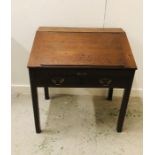 A Mahogany fall fronted Masters desk with two front drawers, brass drop handles.