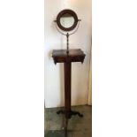 A Victorian mahogany shaving stand with mirror and drawer