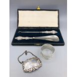 A silver napkin ring, decanter label 'Sherry' and a cased button hook and shoe horn with silver