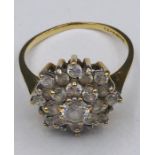 A Daisy style ring with CZ and 9ct yellow gold setting