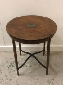 An Edwardian round Mahogany occasional table decorated with hand painted center.