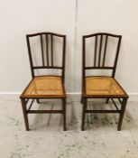 Two cane seated chairs, one as found.