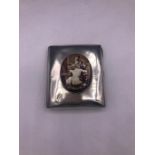 A silver calling card case with pictorial enamel depicting a nude figure
