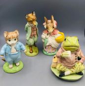 A selection of four Beswick Ware Beatrix Potter figures to include Jeremy Fisher in original boxes